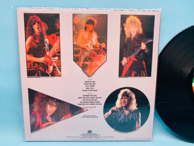 Photo 2 of 802808…great condition Ratt vinyl record in plastic sleeve cover and record in great condition for age 