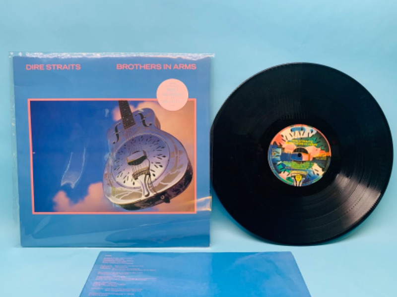 Photo 1 of 802810…great condition dire straits vinyl record in plastic sleeve cover and record in great condition for age 