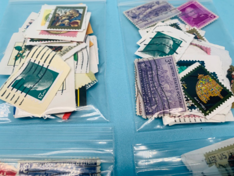 Photo 2 of  802899…hundreds of used stamps in bags 