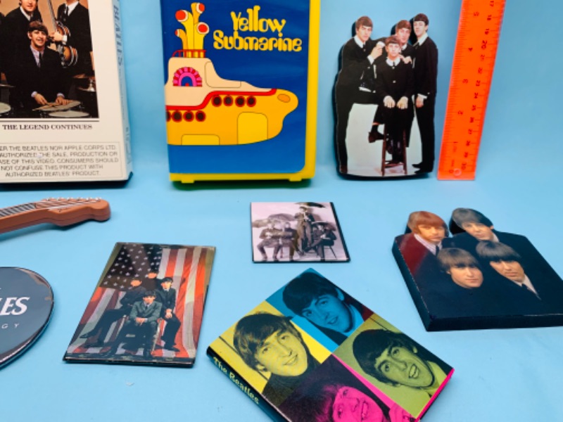 Photo 2 of 802977…Beatles collectibles- vhs tapes, pin, magnets, cut outs and more