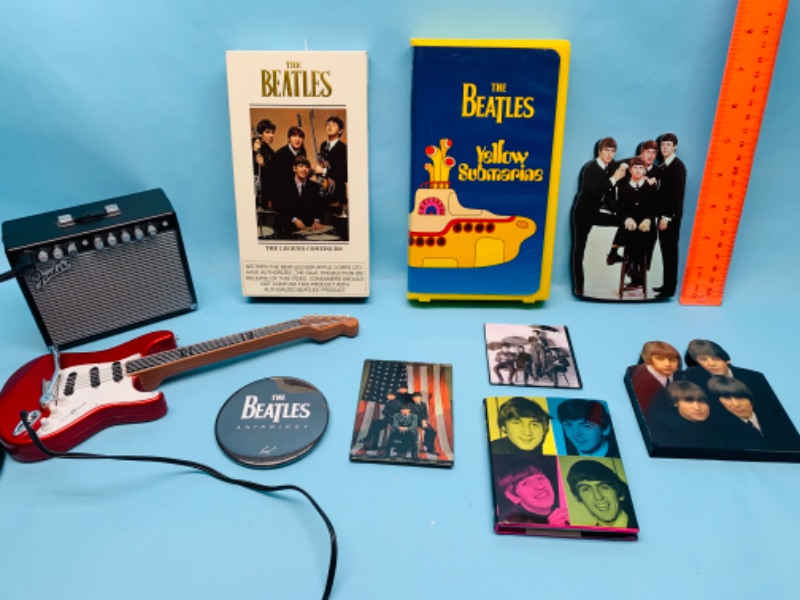 Photo 1 of 802977…Beatles collectibles- vhs tapes, pin, magnets, cut outs and more