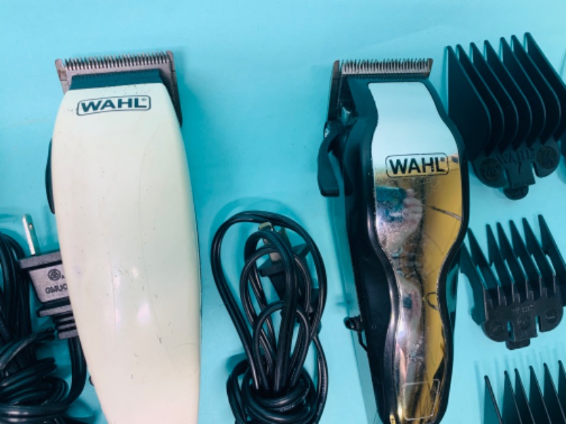 Photo 2 of 803212…2 wahl clippers with attachments - bag zipper is broken 
