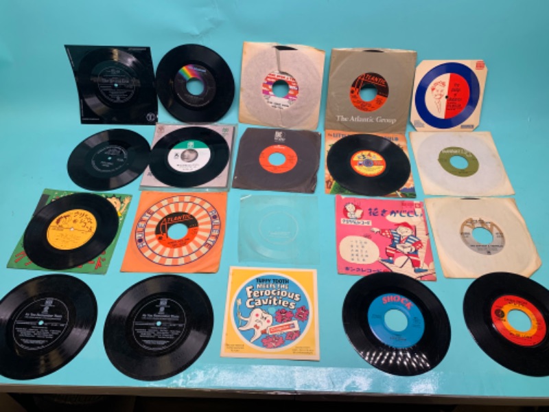 Photo 1 of 803215…. Vinyl 45 rpm records - some vintage, loose, and flimsy/ bendable 
