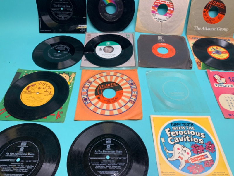 Photo 4 of 803215…. Vinyl 45 rpm records - some vintage, loose, and flimsy/ bendable 
