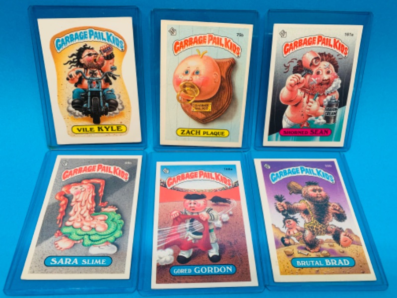 Photo 1 of 803594… 6 vintage garbage pail kids sticker cards in hard plastic sleeves 