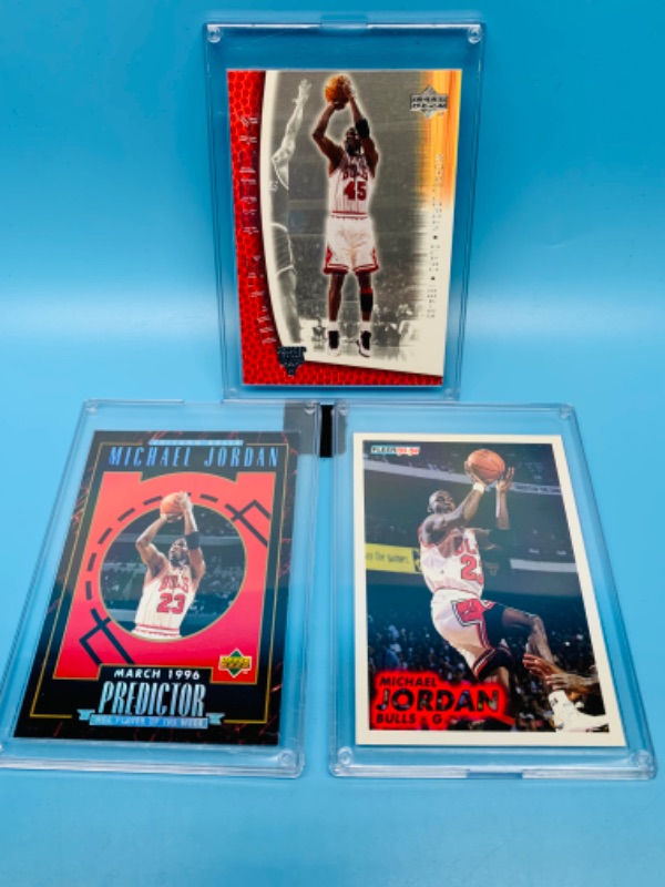 Photo 1 of 804148… 3 Michael Jordan trading cards in hard plastic cases