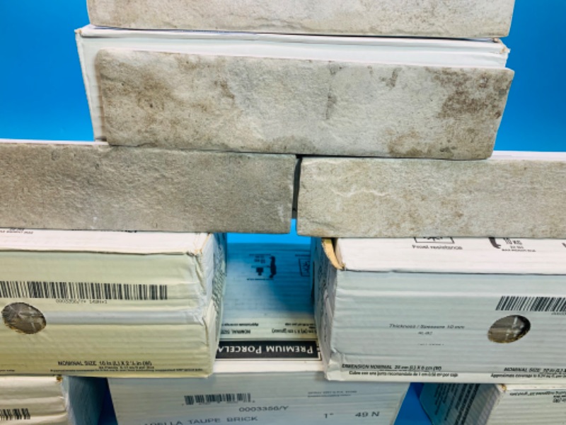 Photo 7 of 804348…12 boxes of premium porcelain tile. 10 inch x 2 1/2 inch. Capella toupe brick color. 32 pieces per box 6.24 square feet per box 74.88 total square feet 