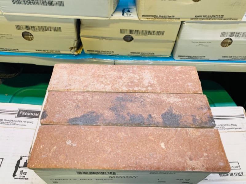 Photo 6 of 804349… 12 boxes of premium porcelain tile. 10 inch x 2 1/2 inch. Capella red brick color. 32 pieces per box 6.24 square feet per box 74.88 total square feet 