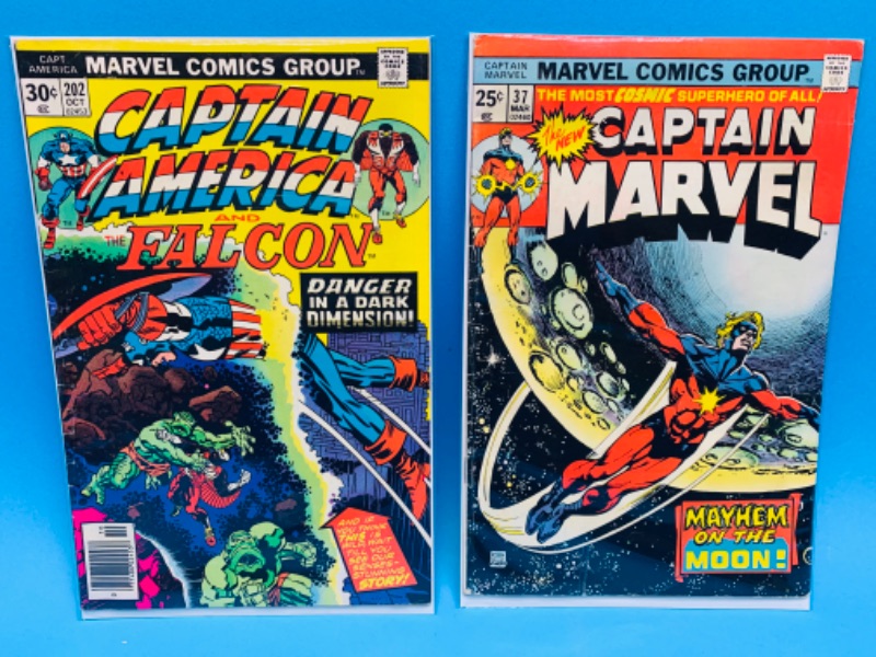 Photo 1 of 804357…vintage captain marvel and captain America $.25 and $.30 cent comics in plastic sleeves 