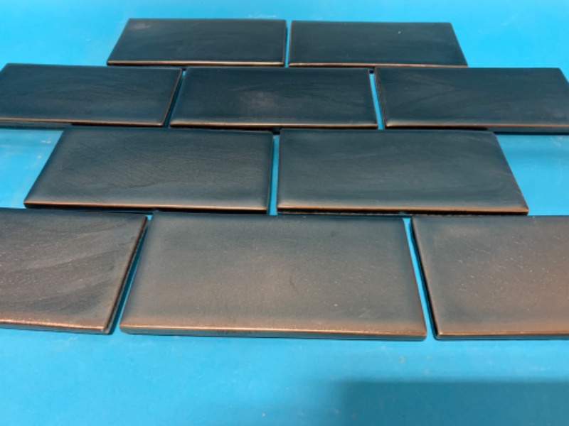 Photo 5 of 804481…25 boxes 100 square feet of Sonoma gun metal 3x6 inch tiles  see photos 