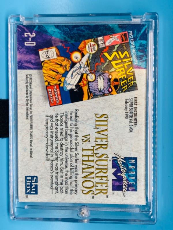 Photo 2 of 804548…1992 Marvel masterpieces silver surfer versus Thanos foil card 2-D in hard plastic case