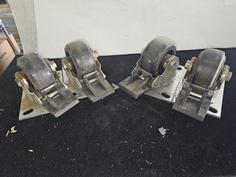 Photo 1 of set of 4 RMW heavy duty locking casters 4" wheel 5.5 inch overall height 