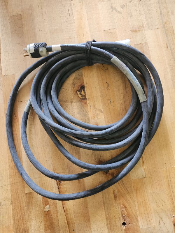 Photo 1 of Heavy duty extension cord 12/3 appx 25 feet edison  
