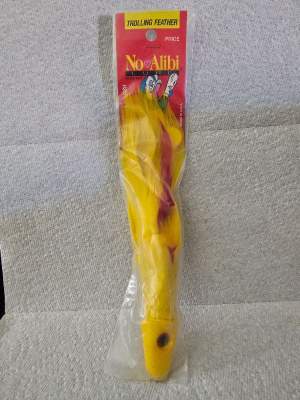 Photo 1 of No Alibi, Trolling Feather Lure, Yellow/Red Skirt, 6oz Head