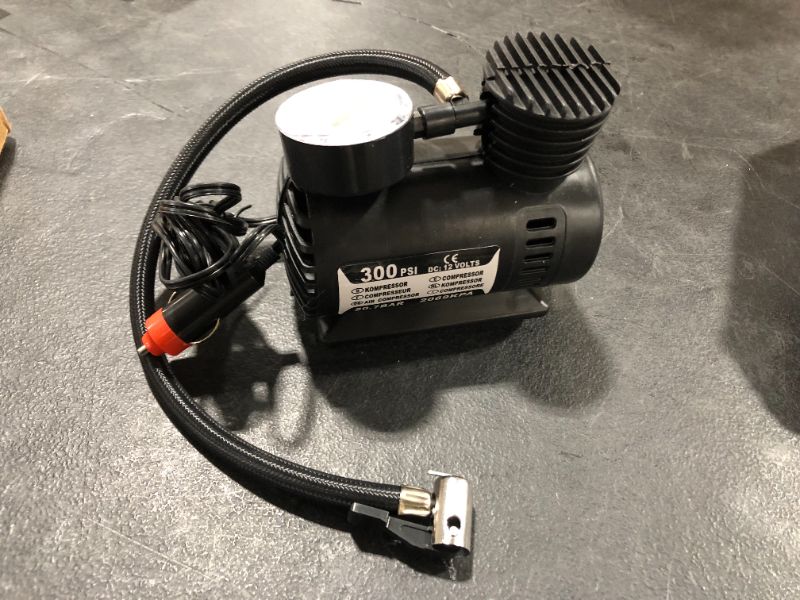 Photo 2 of Black Portable Versatile 12V air compressor 