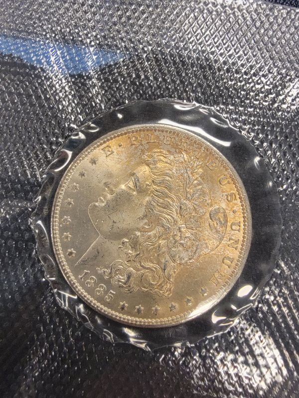 Photo 2 of 1885-O Uncirculated Sealed Morgan Dollar