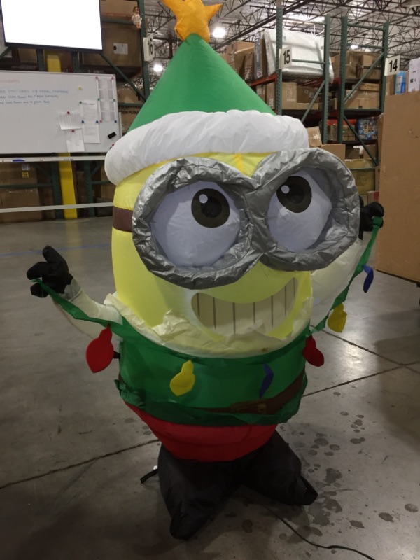 Photo 2 of Gemmy 4Ft. Tall Christmas Inflatable Airblown Minion Dave in Green Elf Suit with Star On His Cap Indoor/Outdoor Holiday Decoration
