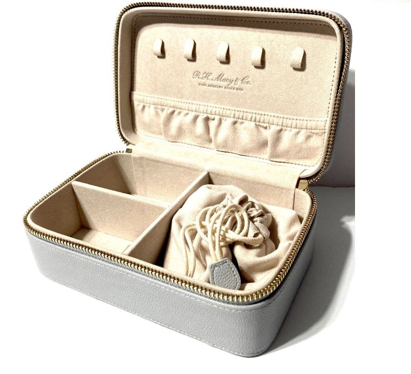 Photo 4 of A spacious jewelry GREY case that can store a variety of jewelry pieces, keeping them secure and organized within multiple compartments, and a drawstring pouch. Ideal for a long trip or a short getaway. Removable drawstring pouch - Necklace Hooks - Elasti