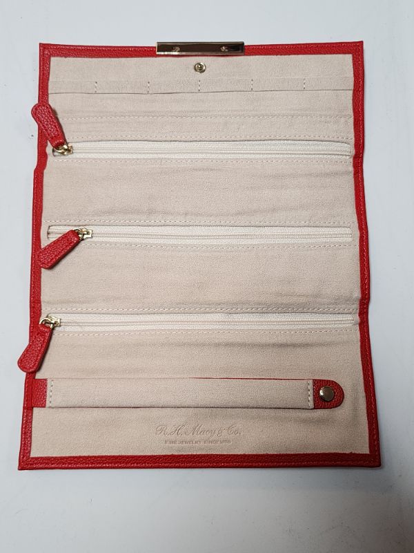 Photo 2 of R.H. Macy & Co Jewelry Roll RED Pebble Leather Necklace Holder Ring Roll. Red pebbled leather with gold colored hardware, snap closure
Beige soft suede interior -  6 necklace holders -  1 large slip pocket (8.25in H x 7.75in W) - 3 zip pockets - 1 ring ro