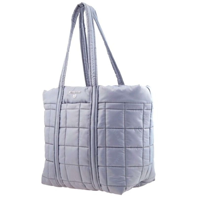 Photo 3 of Michael Kors Stirling Large Puffy Tote. Michael Kors Ladies Tote. Color: Grey. Michael Kors Stirling Large Quilted Padded Tote Bag - Grey. A quilted tote bag from Michael Kors features dual top carry handles, one main internal compartment and a silver-ton