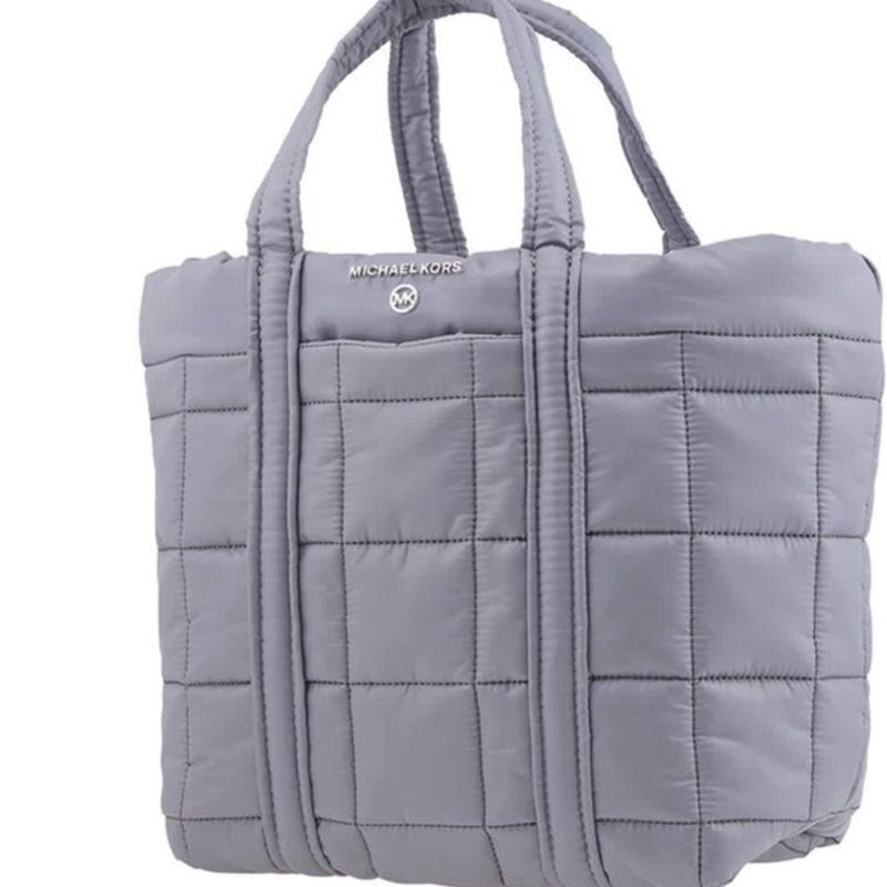 Photo 5 of Michael Kors Stirling Large Puffy Tote. Michael Kors Ladies Tote. Color: Grey. Michael Kors Stirling Large Quilted Padded Tote Bag - Grey. A quilted tote bag from Michael Kors features dual top carry handles, one main internal compartment and a silver-ton