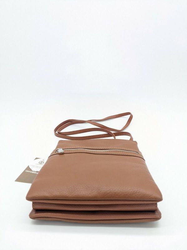 Photo 4 of GIANI BERNINI Dasher pebble leather triple zip women's crossbody organizer -TAN. GIANI BERNINI triple-zip dasher pebble genuine leather women's crossbody organizer bag purse
Carry the essentials in this every-day bag designed by Giani Bernini.
Solid brown