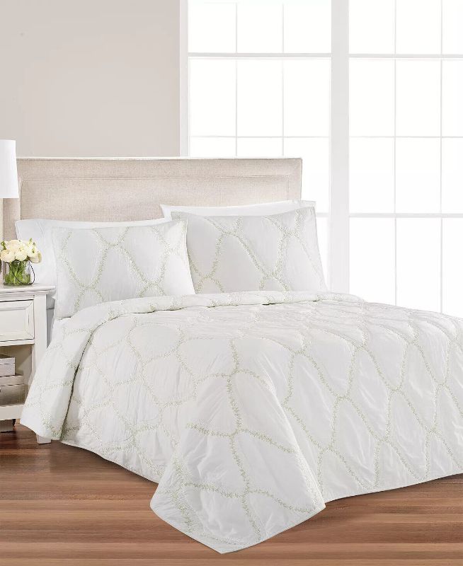 Photo 1 of QUEEN - Floral Embroidered Geo Quilt Quilt, Full/Queen - White - 100% Cotton. Layer it in with the all over stripe, or flip it over to stand on its own!  This reversible yarn dye pinwheel patchwork will bring a fresh spring feeling to your bedroom.
Quilt 