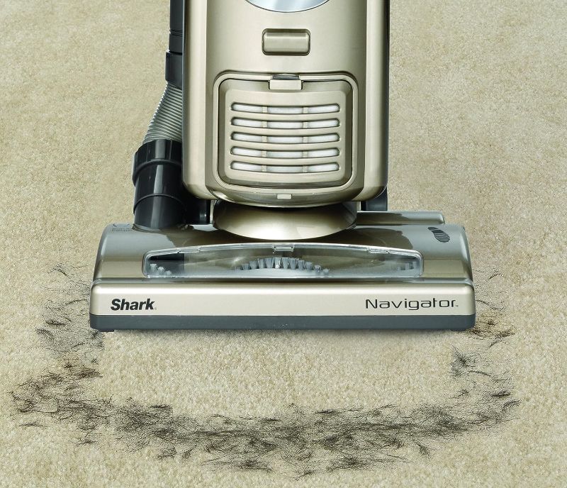 Photo 5 of Shark NV42 Navigator Deluxe Upright Corded Bagless Vacuum. Keep the messes at bay with a self-propelling Shark Navigator NV42 cleaner. This upright gold vacuum is extremely light, meaning you can take it all over the house with ease. The Shark vacuum is d