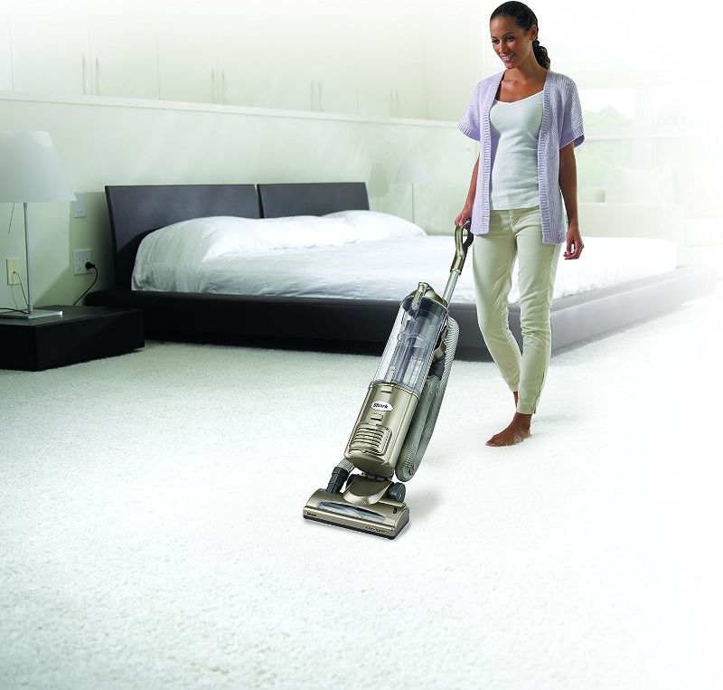 Photo 2 of Shark NV42 Navigator Deluxe Upright Corded Bagless Vacuum. Keep the messes at bay with a self-propelling Shark Navigator NV42 cleaner. This upright gold vacuum is extremely light, meaning you can take it all over the house with ease. The Shark vacuum is d