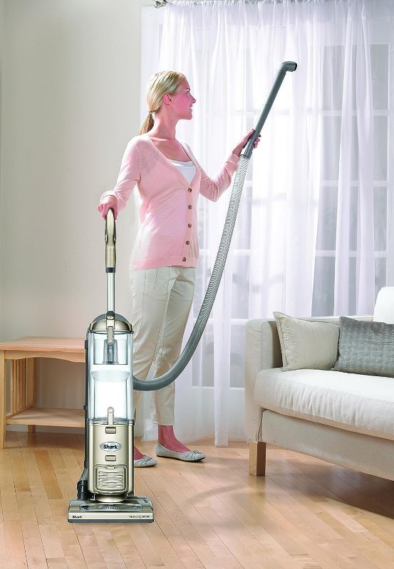 Photo 3 of Shark NV42 Navigator Deluxe Upright Corded Bagless Vacuum. Keep the messes at bay with a self-propelling Shark Navigator NV42 cleaner. This upright gold vacuum is extremely light, meaning you can take it all over the house with ease. The Shark vacuum is d