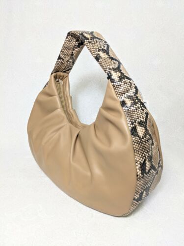 Photo 2 of INC International Concepts KJ Hobo, Created for Macy's
Faux-leather, snake print handle. Wedge shape. 
Color: Camel, snake.
Dimensions: 15" W x 10" H x 4" D  (38 cm W x 25.5 cm H x 10 cm D)
Closure: Zipper
Fabric: Faux-leather
Lining: Polyester
Strap type