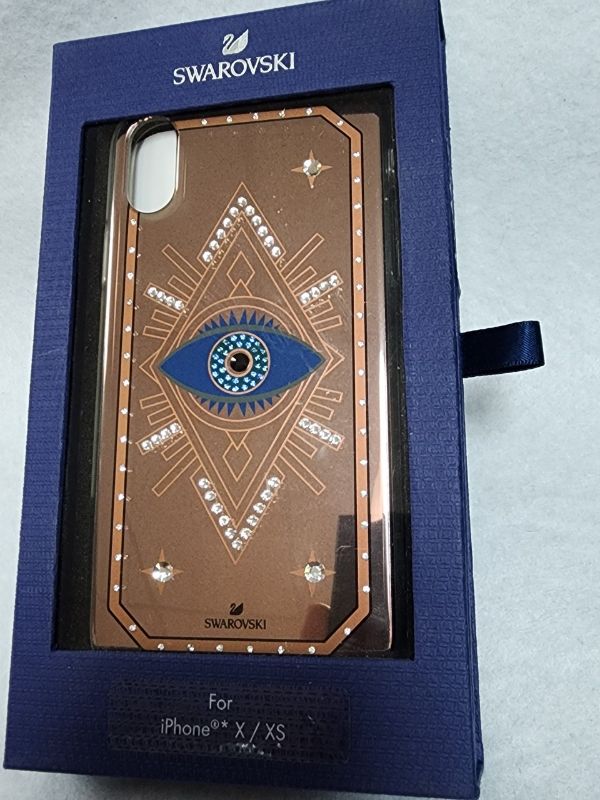 Photo 2 of ONLY FOR IPHONE XS / X  -  Swarovski Tarot Eye Smartphone Case, iPhone® X/XS, Pink Gold. Make a style statement this season with this unique smartphone case for the iPhone® X/XS . The luxe-bohemian design is crafted in a rose-gold color mirror finish and 