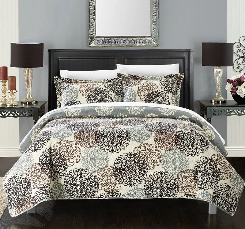 Photo 1 of QUEEN CHIC HOME Kelsie 3 Piece Queen Quilt Set. A fashion forward quilt features a contemporary round scroll design reverses to traditional jacquard motif. Design coordinated shams are included to complete the look. Product dimension - 86"D x 86"W x 1"H. 