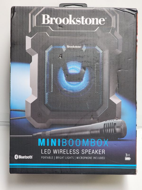 Photo 2 of Brookstone Mini Boombox Portable LED Wireless Speaker with Microphone. With light-up capabilities for added fun, this mini boombox from Brookstone features a mic and convenient carrying handle.