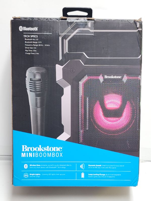 Photo 3 of Brookstone Mini Boombox Portable LED Wireless Speaker with Microphone. With light-up capabilities for added fun, this mini boombox from Brookstone features a mic and convenient carrying handle.