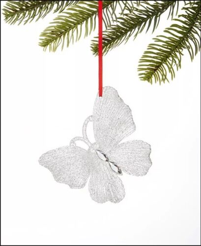 Photo 1 of Holiday Lane Shine Bright Butterfly Ornament. Aflutter with glitter and faux jewels, Holiday Lane's Shine Bright Butterfly ornament adds a sparkling accent to your tree while complementing a variety of decorating themes. Approx. dimensions: 4"L x 0.2"W x 