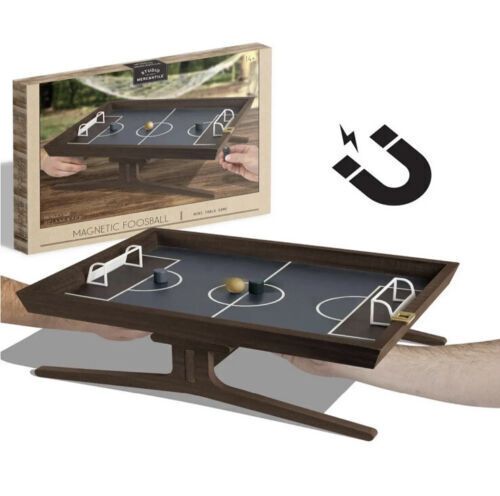 Photo 1 of Studio Mercantile Game - Table Top Magnetic Foosball. he Studio Mercantile magnetic foosball game is a stylish and modern take on a beloved classic game. Dimension - 19" L x 1.8" W x 14.6" H. Set includes - 1 magnetic handle, 1 ball, 2 player pieces. Use 