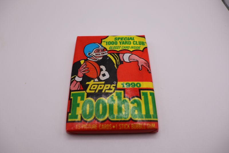 Photo 1 of 1990 Topps Football wax pack (sealed)