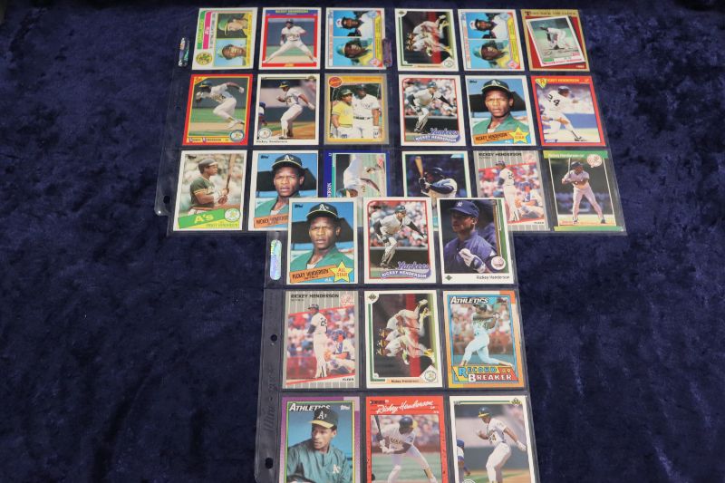 Photo 1 of 27 Rickey Henderson cards in pages