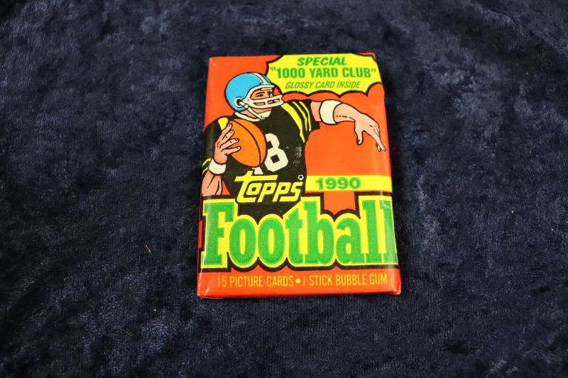 Photo 1 of 1990 Topps Football wax pack (sealed)