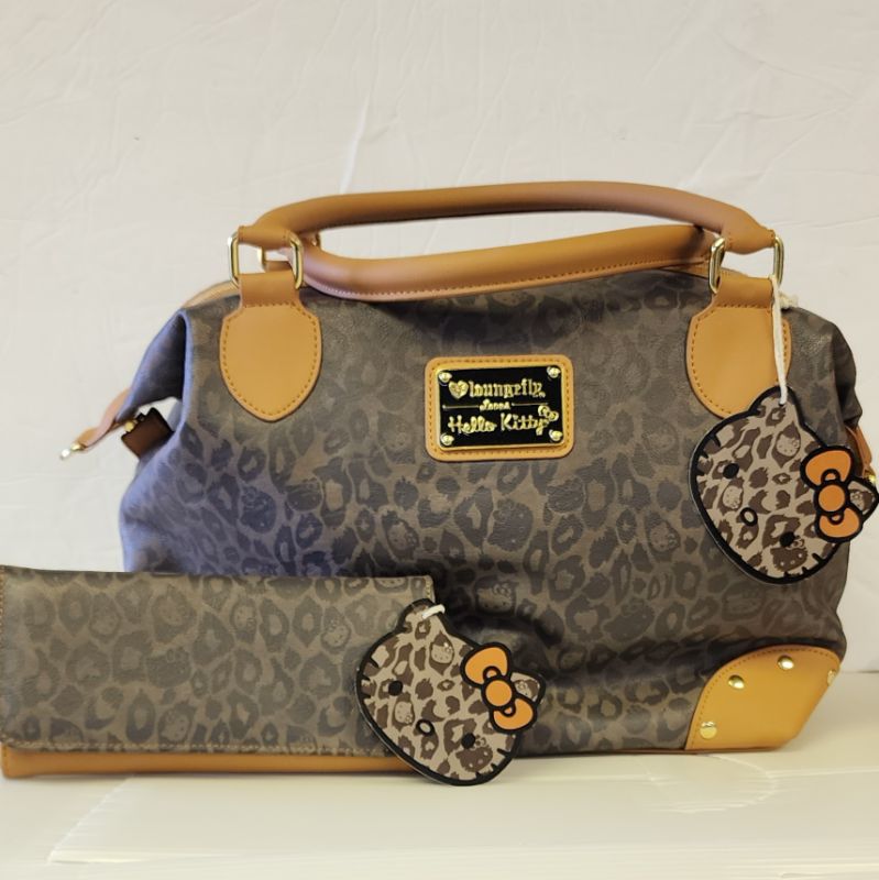 Photo 1 of LOUNGEFLY X SANRIO HELLO KITTY BAG AND WALLET LEOPARD COLLECTION
LIKE NEW CONTION