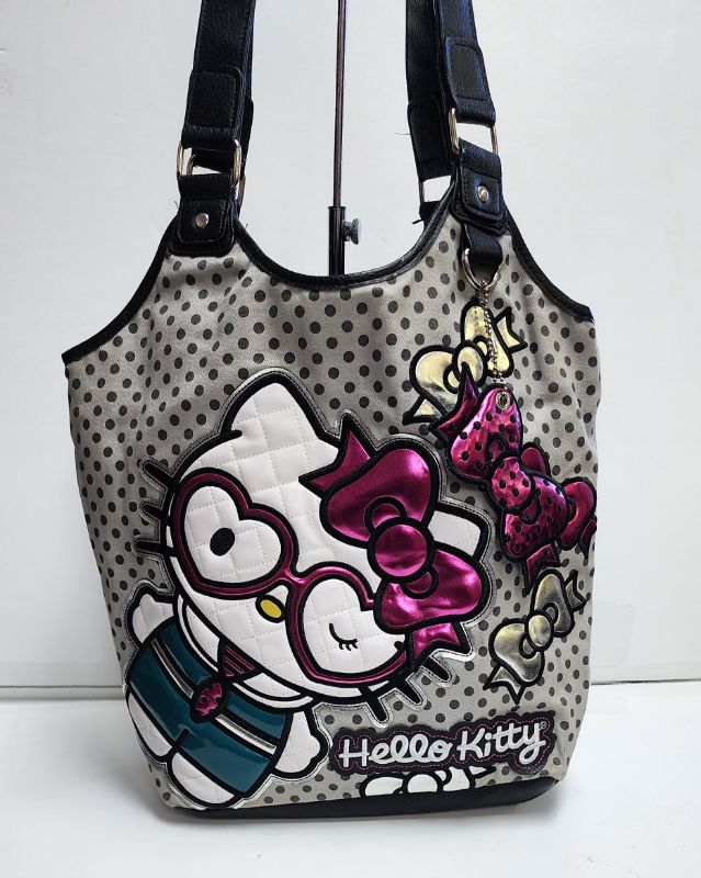 Photo 2 of LOUNGEFLY X SANRIO HELLO KITTY TOTE AND WALLET COLLECTION
LIKE NEW CONDTION