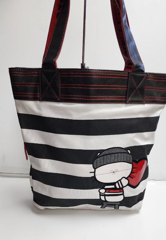 Photo 2 of LOUNGEFLY X SANRIO HELLO KITTY TOTE AND WALLET BANDIT COLLECTION
LIKE NEW CONDITION