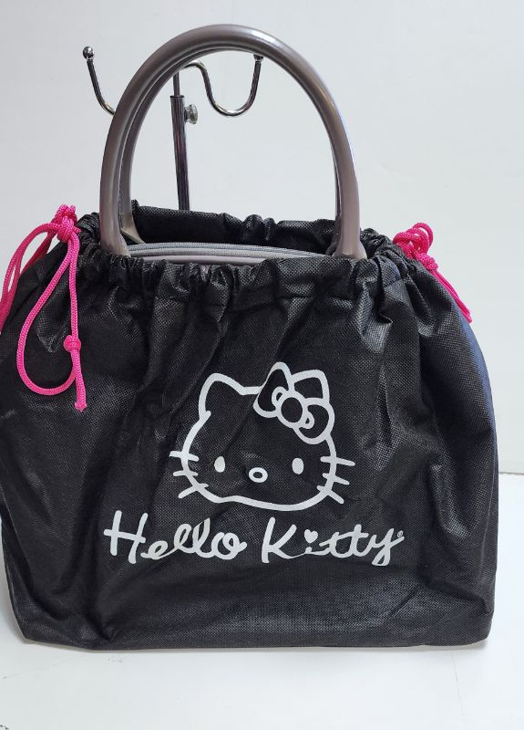 Photo 2 of LOUNGEFLY X SANRIO HELLO KITTY LARGE EMBOSSED DOME HANDBAG WITH DUST BAG
LIKE NEW CONDITION