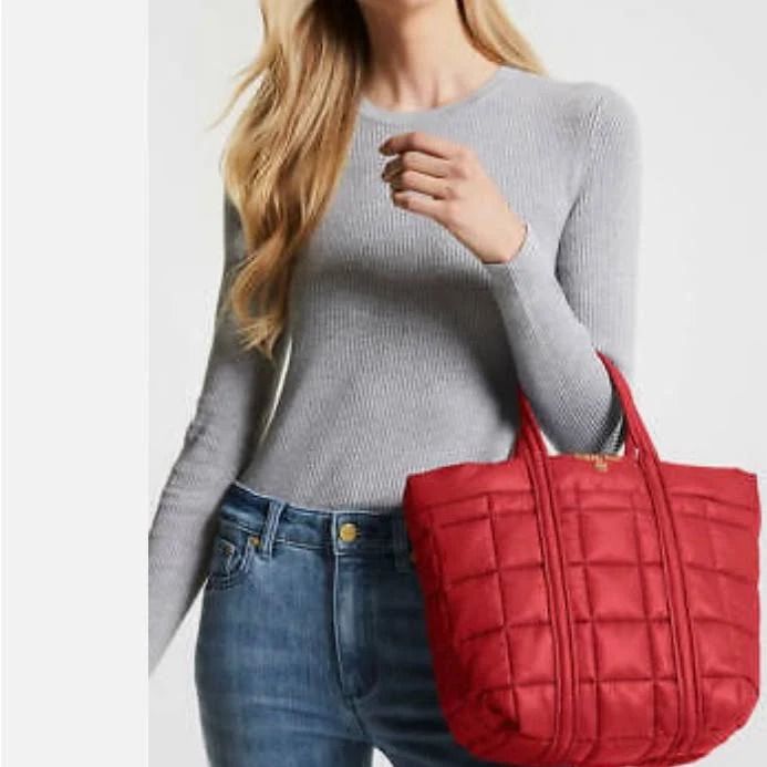 Photo 1 of MICHAEL Michael Kors Stirling Small Grab Tote Red
Top handles, 10" drop
Dimensions: 17.75"W x7.25"D x12.25"H - Dog clip closure
Two exterior slip pockets & three interior slip pockets
Quilted pattern