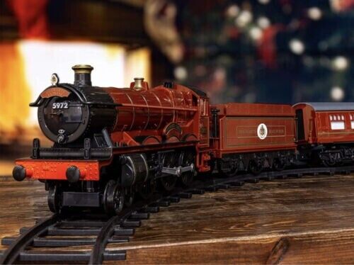 Photo 2 of Harry Potter 37 Piece Train Set Hogwart Express LIONEL Battery Powered Steam. Step through Platform 9 ¾ and take a ride on the Hogwarts Express! Witches, wizards and even Muggles can easily control this battery powered remote controlled train set. Featuri