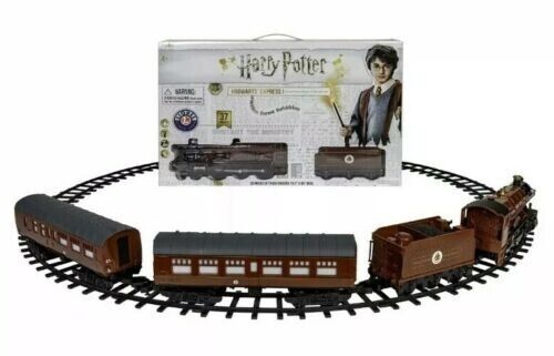 Photo 1 of Harry Potter 37 Piece Train Set Hogwart Express LIONEL Battery Powered Steam. Step through Platform 9 ¾ and take a ride on the Hogwarts Express! Witches, wizards and even Muggles can easily control this battery powered remote controlled train set. Featuri
