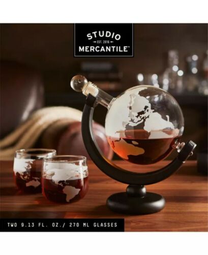 Photo 1 of Studio Mercantile Whiskey Globe Decanter Set. Studio Mercantile whiskey decanter set steps up the style of any bottle. This earth-shaped decanter holds your favorite libations with a sophisticated look that seems more purposeful and planned on any shelf o