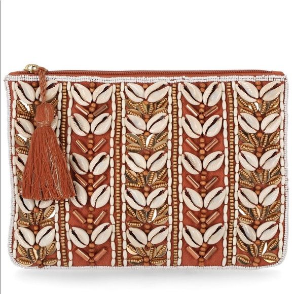 Photo 1 of International Concepts Kimmy Women's Shell Pouch. Kimmyy Women's Shell Pouch • Body- canvas, lining- twill • Small sized bag- 8"W x 1/4"H x 6"D, weight- 0.12 lbs. • Magnetic snap closure • Gold- tone exterior hardware- shell, beads, tassel • Polyester, IN