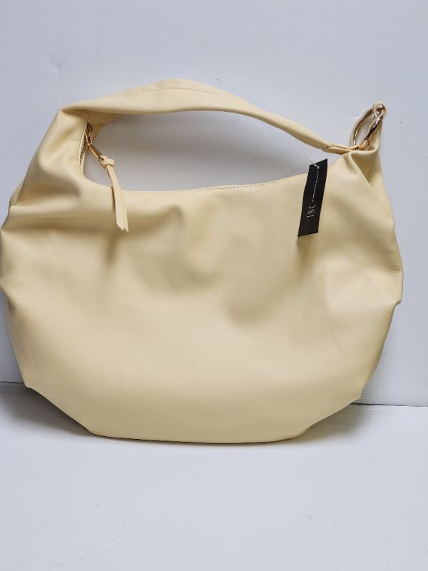 Photo 1 of INC International Concepts Claire Hobo Shoulder Bag. ??Color: Butter (Yellow) ??Material: Body & Trim: PU; Lining: Polyester. ??Hardware: Gold-tone
??Interior: 2 interior slip pockets & 1 zip pocket ??Closure: Top zip closure Dimensions: Extra-large sized